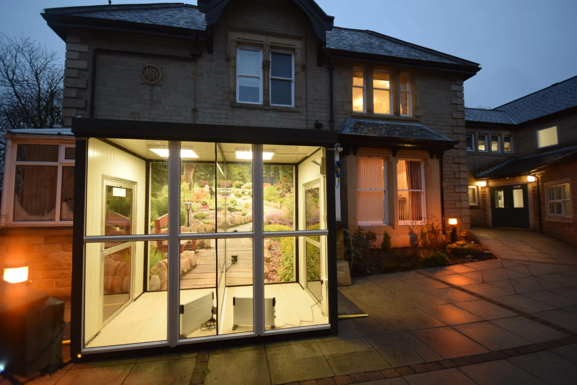 care home visitor compact pod illuminated with immersive graphic wall