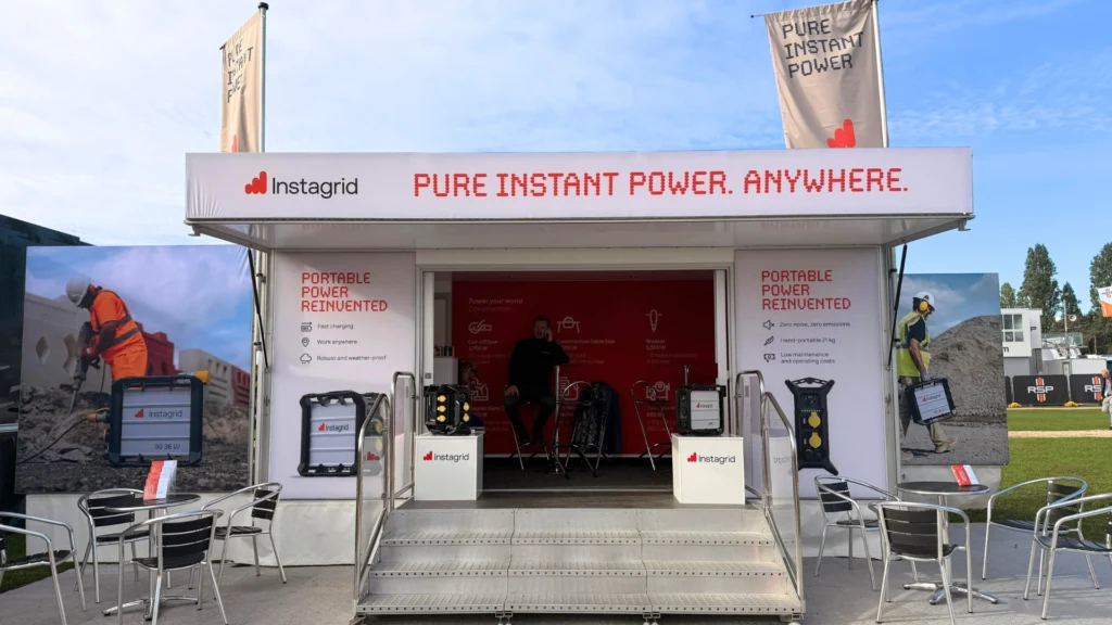 Instagrid promotional booth showcasing portable power solutions at an outdoor event.