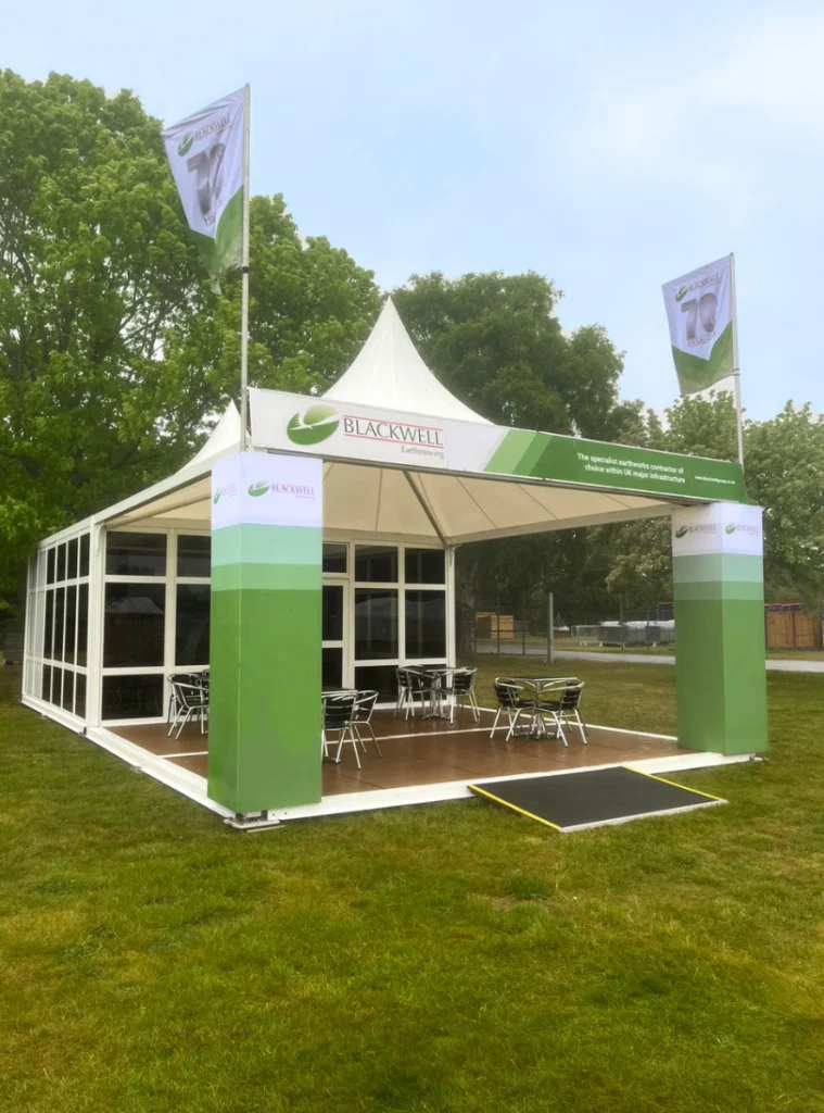 Blackwell Earthmoving branded event marquee set up on a grassy field.