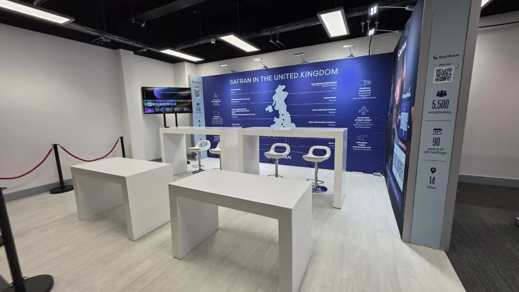 Safran exhibition booth featuring a map of the United Kingdom and company statistics.